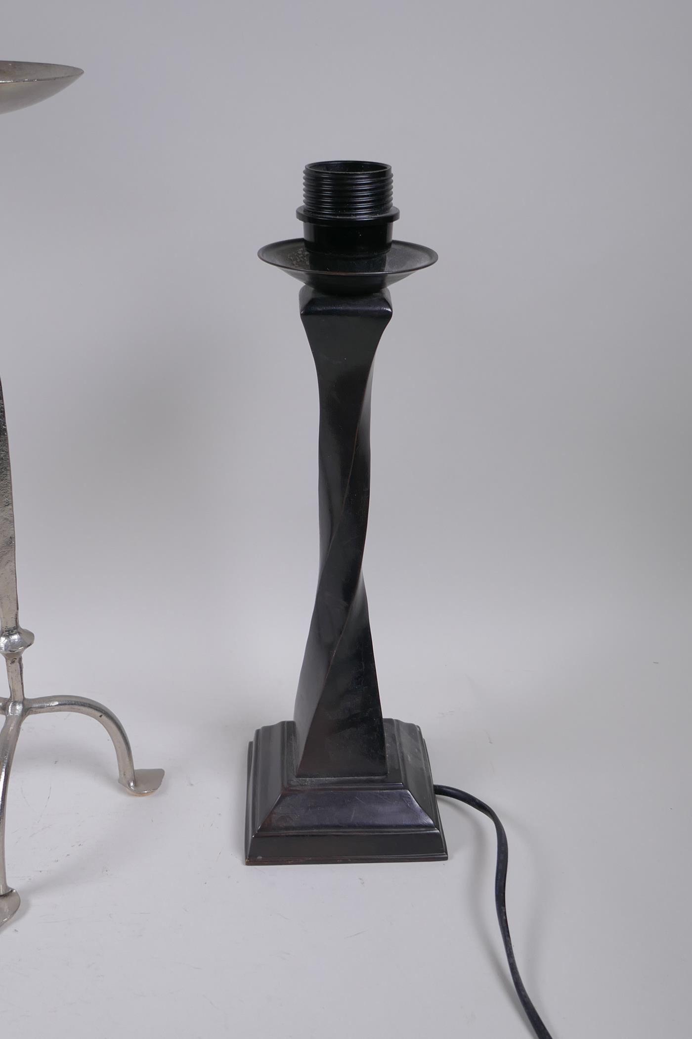 A plated pricket candle stick and another, smaller, together with two bronze table lamps, largest - Image 4 of 4