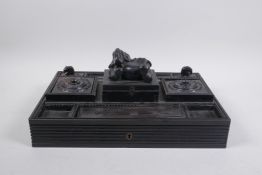 An Anglo Indian ebony desk set with elephant mounts, 33 x 22cm