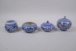 Three Chinese blue and white porcelain pots and covers with scrolling floral decoration, and a