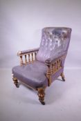 A Victorian oak, button back leather easy chair, open arms with turned supports, stamped Howard &