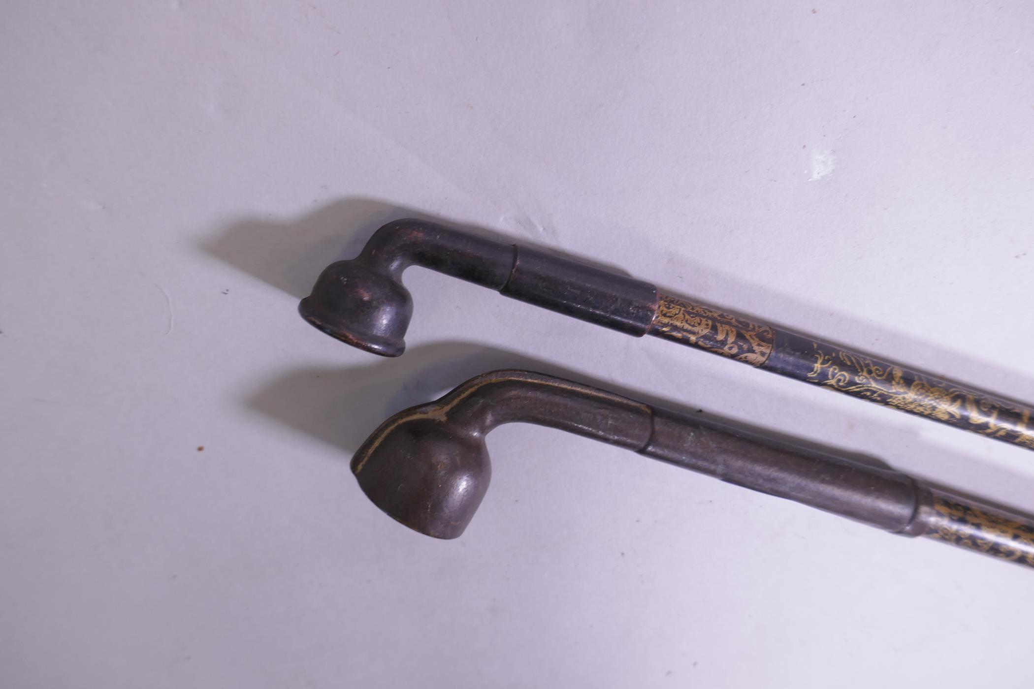 A Chinese opium pipe with gilt decorated shaft and another similar, 47cm long - Image 4 of 4