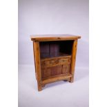 A Chinese elm cabinet fitted with two drawers and sliding doors, 75 x 36cm, 85cm high