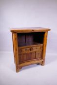 A Chinese elm cabinet fitted with two drawers and sliding doors, 75 x 36cm, 85cm high