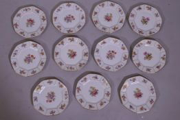 Eleven William Guerin & Co Limoges tea plates with floral decoration gilt borders, 21cm diameter