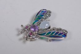 A 925 silver and plique a jour brooch in the form of a fly, set with an amethyst cabochon, 4cm