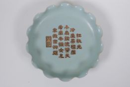 A Chinese Ru ware style pottery dish with a frilled rim and character inscription to bowl, mark to
