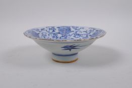 A C19th blue and white porcelain footed dish with bat and auspicious symbol decoration, Chinese