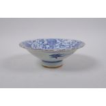 A C19th blue and white porcelain footed dish with bat and auspicious symbol decoration, Chinese