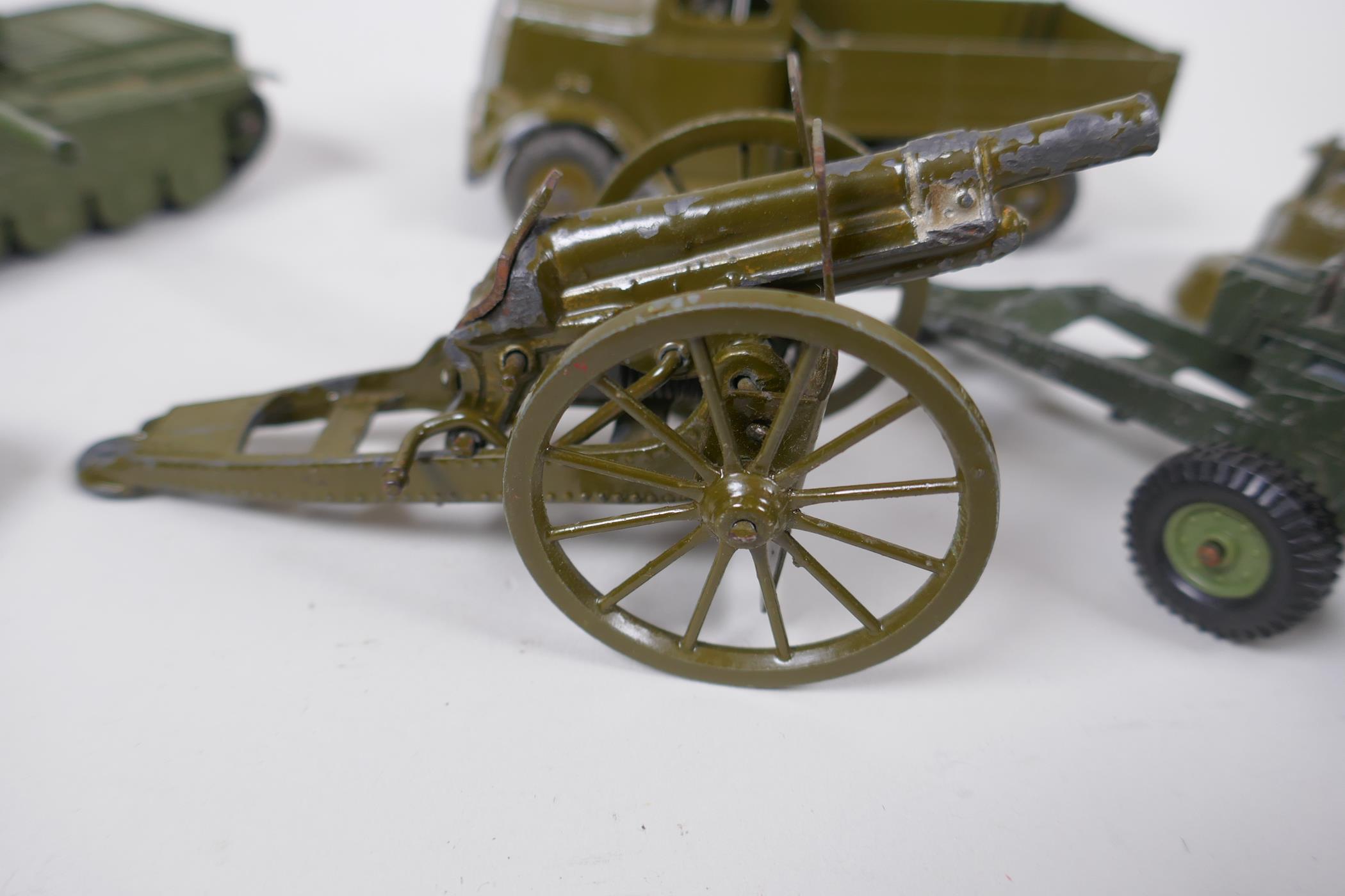 A Britains model six wheel army tipper truck with driver, a Britains Howitzer, two field guns, a - Image 2 of 5