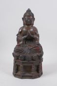 A Chinese bronze of buddha seated in meditation, with a character inscription to the reverse and the