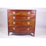 A C19th mahogany bowfront chest of two over three drawers with brass plate handles, raised on shaped