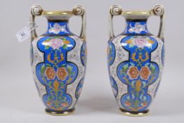 A pair of Noritake vases painted to imitate cloisonne decoration, 25cm high