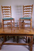 An oak draw leaf dining table and six ladderback dining chairs, 84 x 160cm, 78cm high