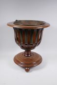 An inlaid mahogany wine cooler with pierced body and brass liner, 41cm high x 38cm diameter