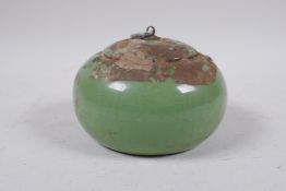 A Chinese celadon crackle glazed porcelain jar and cover, sealed, 13cm diameter