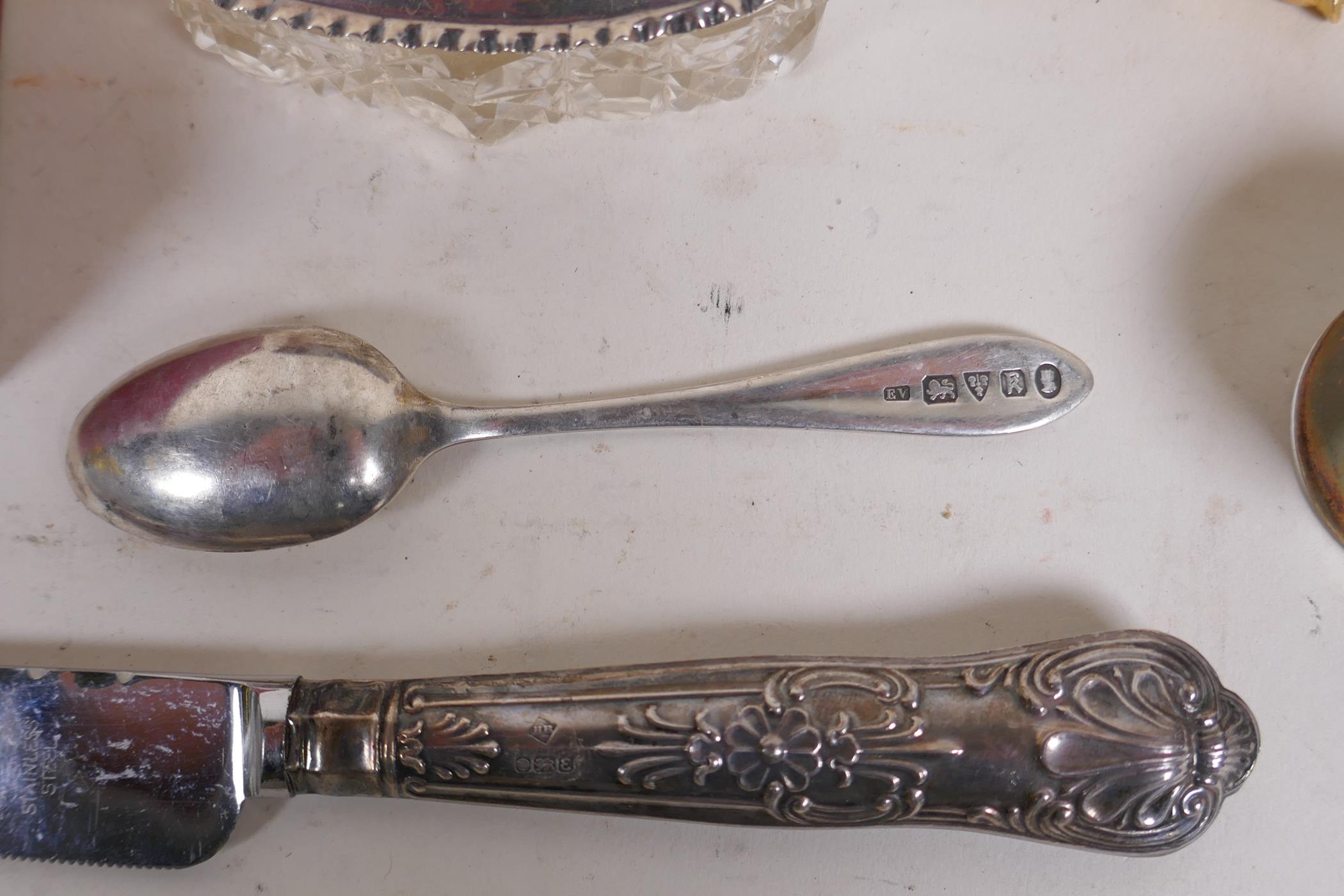 A collection of silver, silver plate and white metal items to include tea spoons, coin spoons, - Image 4 of 9