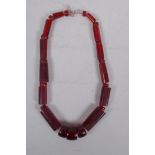 A cherry amber style graduated necklace, 60cm long