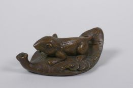 An Oriental bronze incense holder in the form of a mouse on a leaf, 8cm long