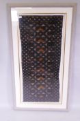 An African Congolese embroidered Kuba textile, framed, 52cm x 118cm