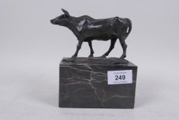A bronze figure of a steer, mounted on a marble base, impressed L. Carvin, 15cm high