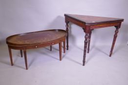 An Arts & Crafts satinwood and coromandel games table with fold over top and an inlaid mahogany