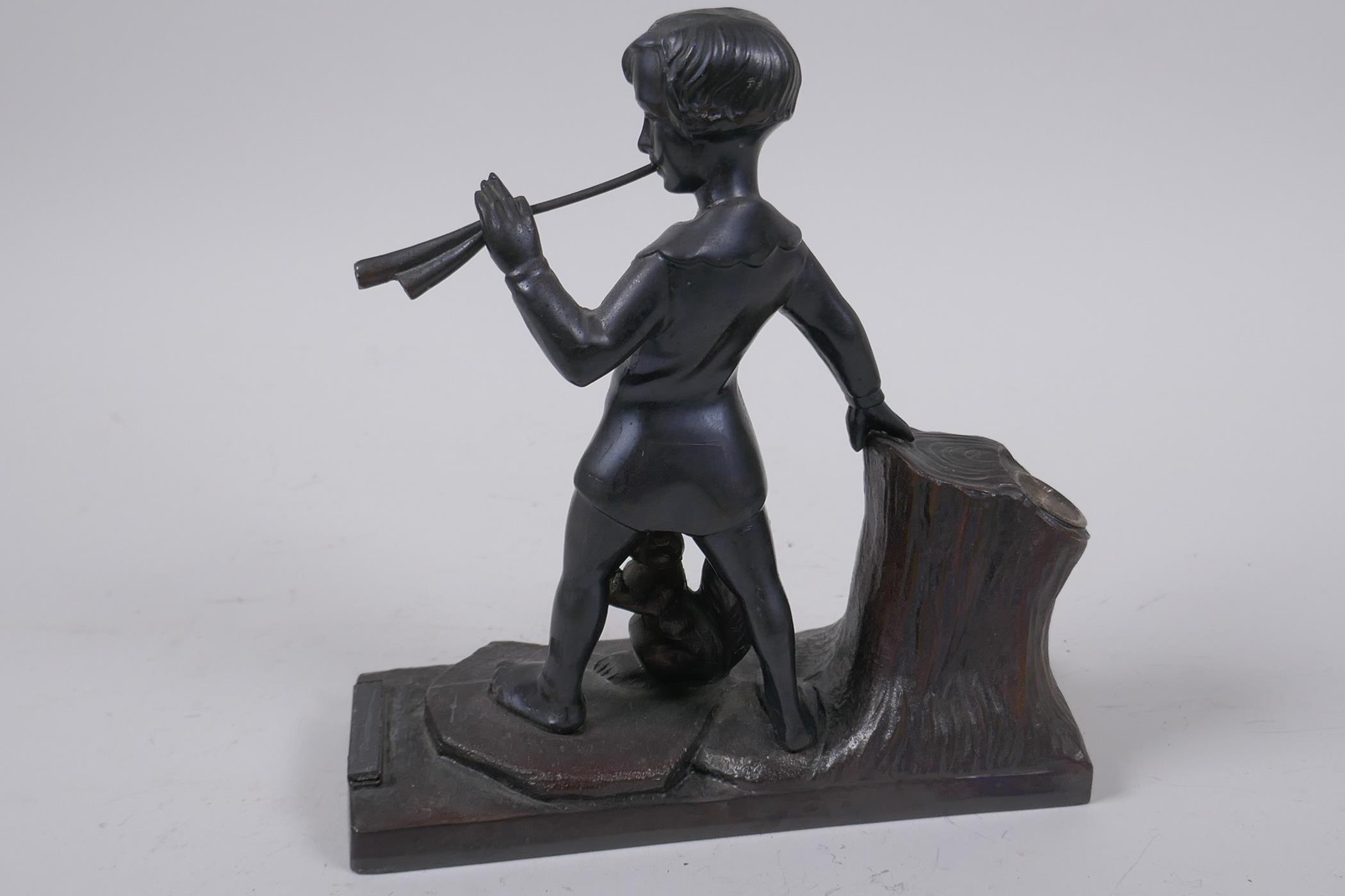 A spelter table top taper stand with striker, modelled as a boy piper and a squirrel, 17cm long - Image 3 of 4