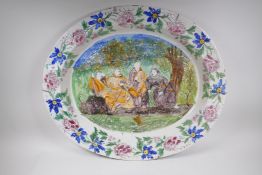 Antique faience charger with decoration of four monks fishing, 74 x 63cm