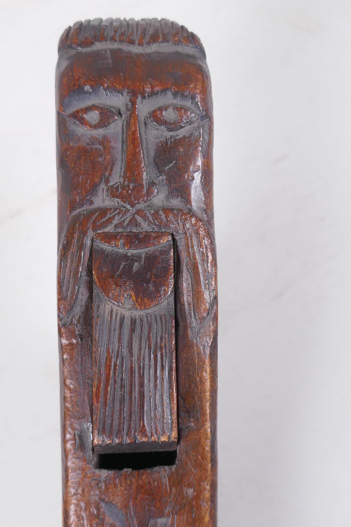 Antique treen nutcrackers with carved decoration of bearded gentlemen, incised R.H. 1761, 28cm long - Image 7 of 8