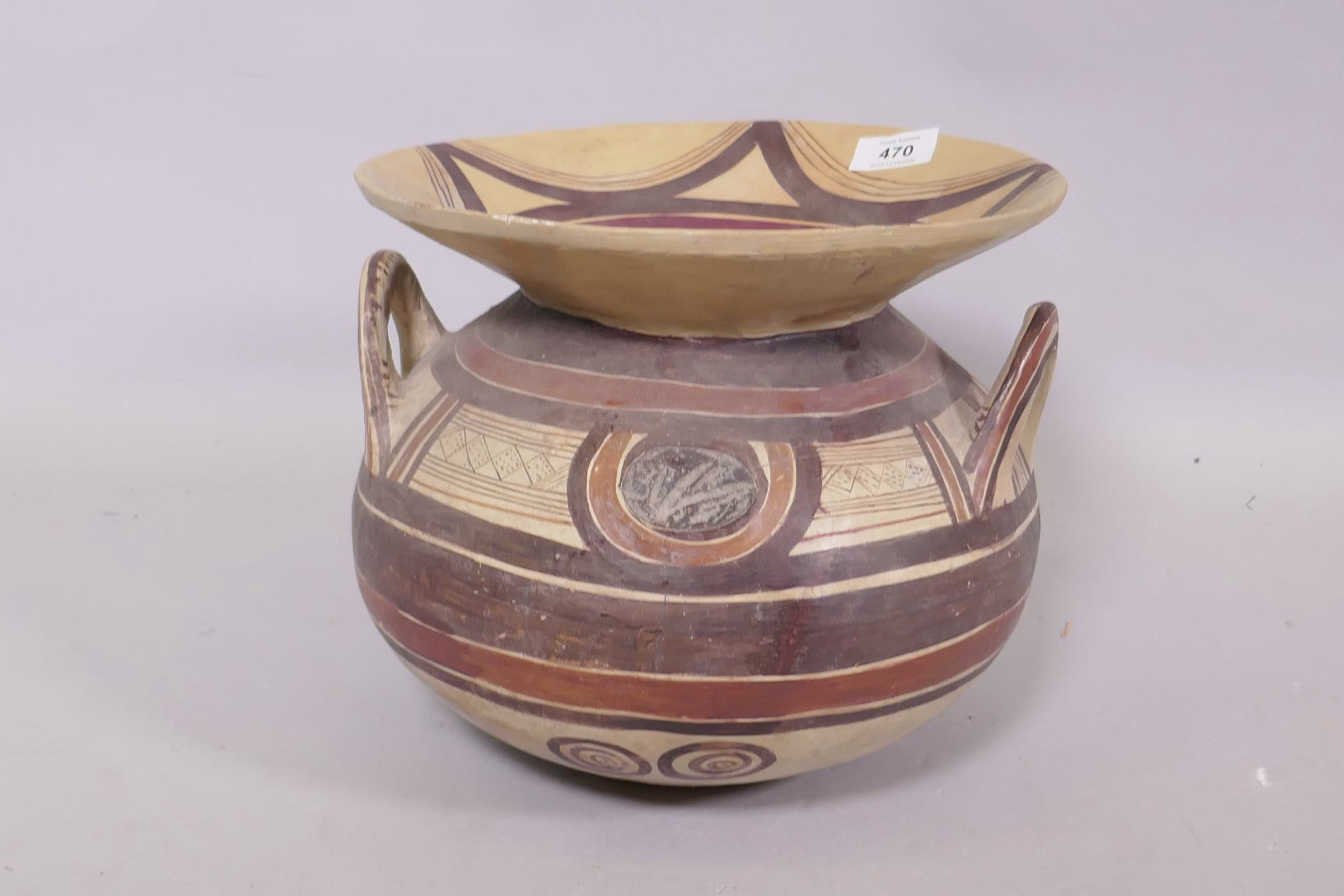 A Middle Eastern terracotta pot with geometric decoration, 25cm high