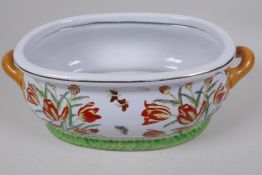 A Chinese porcelain foot bath painted with flowers, butterflies and fish in bright enamels, 43cm