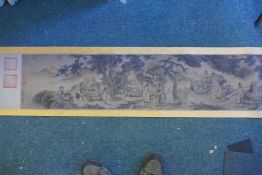 A Chinese printed scroll with an extensive inscription and depictions of buddhist figures, 30cm