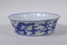 A blue and white porcelain dish of lobed form with dragon decoration, Chinese Xuande 6 character