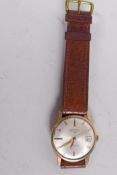 A gentleman's 9ct gold Rotary wristwatch with date window, silvered dial and gold batons and