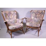 A pair of Ercol hoop back arm chairs
