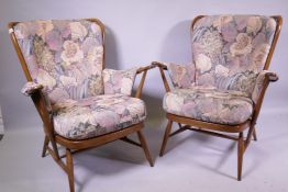 A pair of Ercol hoop back arm chairs