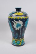 A Chinese Ming style fahua vase of meiping form, decorated with lotus flower and a phoenix, 32cm