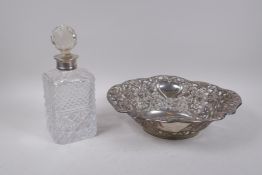 A cut glass decanter with hallmarked silver mount, Birmingham 1992, and a silver plated C.J.