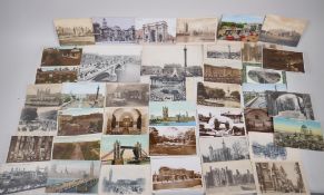 A collection of postcards of historic London scenes and two photographic prints
