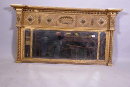 A late Regency giltwood and composition triple over mantel mirror, the ball cornice over a frieze