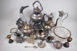 A quantity of silver plated items to include a spirit kettle on stand, claret jugs and a