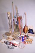 A quantity of sporting equipment including fishing rods, long bow, tennis and badminton rackets,