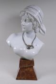 Porcelain bust of a woman in a headscarf, maker's mark to base, 55cm high