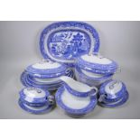 A Wedgwood Seville pattern part dinner service comprising four oval serving platters, largest 40 x