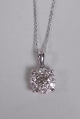 A 9ct white gold and diamond pendant necklace, approx .5ct total weight