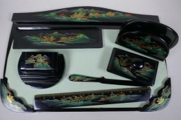 A chinoiserie lacquered seven piece desk set