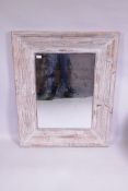 A distressed painted pine wall mirror, 82 x 103cm