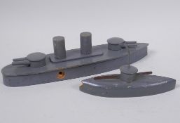 A wooden toy model of a battleship and submarine by Schoenhut, c1914, battleship 29cm, missing