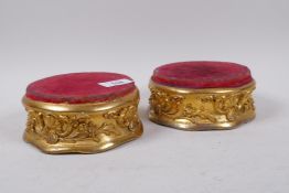 A pair of Victorian giltwood and composition stands with walnut tops, 13cm diameter