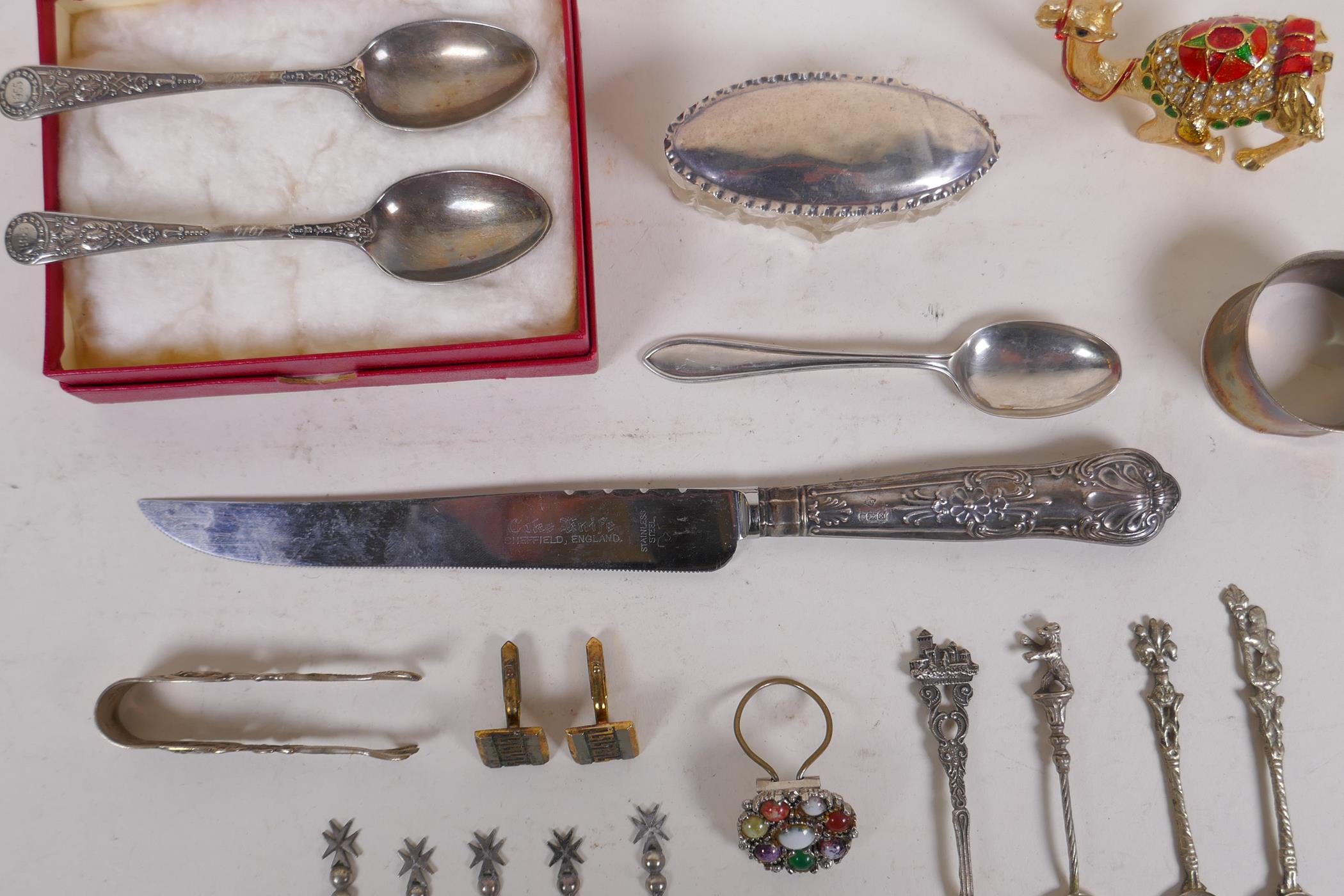 A collection of silver, silver plate and white metal items to include tea spoons, coin spoons, - Image 2 of 9