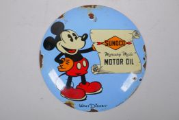 A retro convex enamel Micky Mouse 'Sunoco Mercury made Motor Oil' sign, 30cm diameter